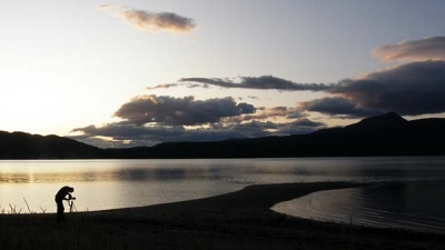 shooting the sunset at Markenes/Balsfjord, Norway. Photo by Jonna