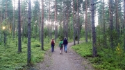 guiding my parents around her magical forest in Hiekkanummi